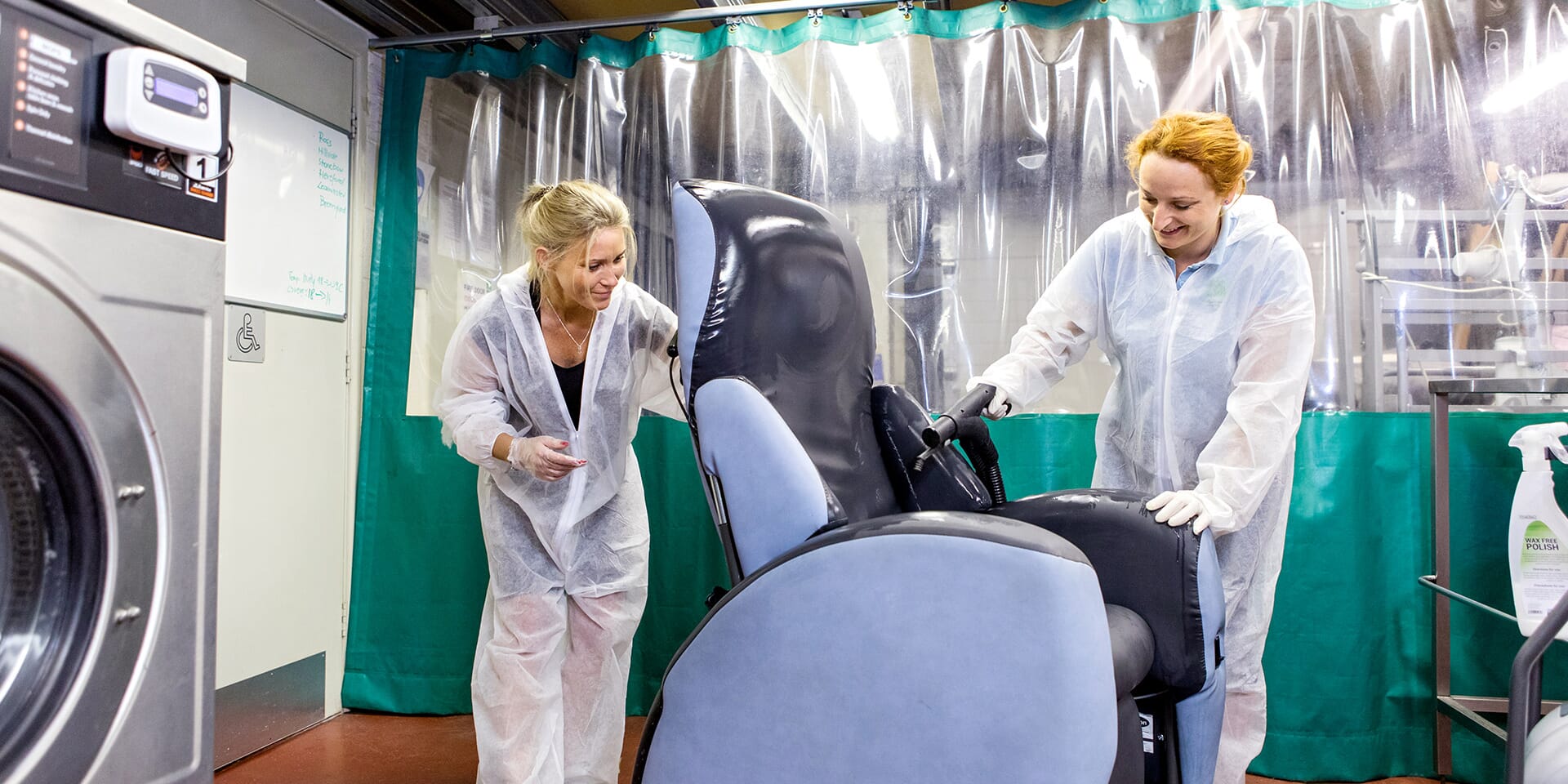 Two Professionals decontaminate Chair.