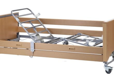 Wooden Frame of Medley Ergo Select Low. Brown on Floor.