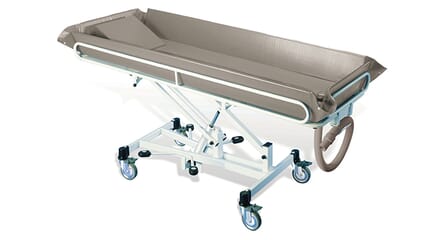 Elevated T1 shower trolley. Brown Plastic Bath, with White Adjustable Legs.