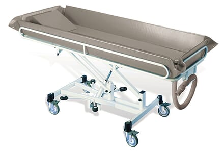 Elevated T1 shower trolley. Brown Plastic Bath, with White Adjustable Legs.