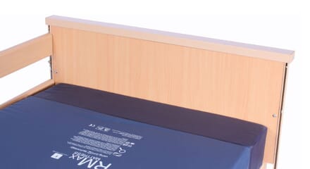 Focussed Image of wooden side board of Bed. Extension Kit.