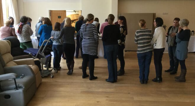 Groups of People Following a Seating and Posture Product Workshop,
