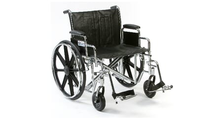 Heavy Duty Wheelchair. Metal Frame and Black Padding. Right Facing.
