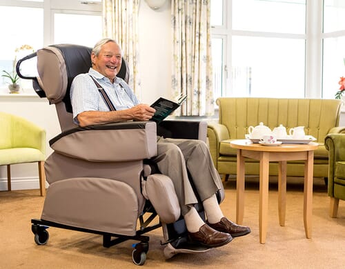 Specialist Seating with elderly man sat facing right.