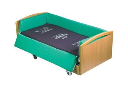 Ultra Safe Cocoon, Small Bed with Green Side Boards and Brown Headboard.