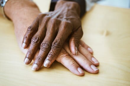 Two hands one on top of another
